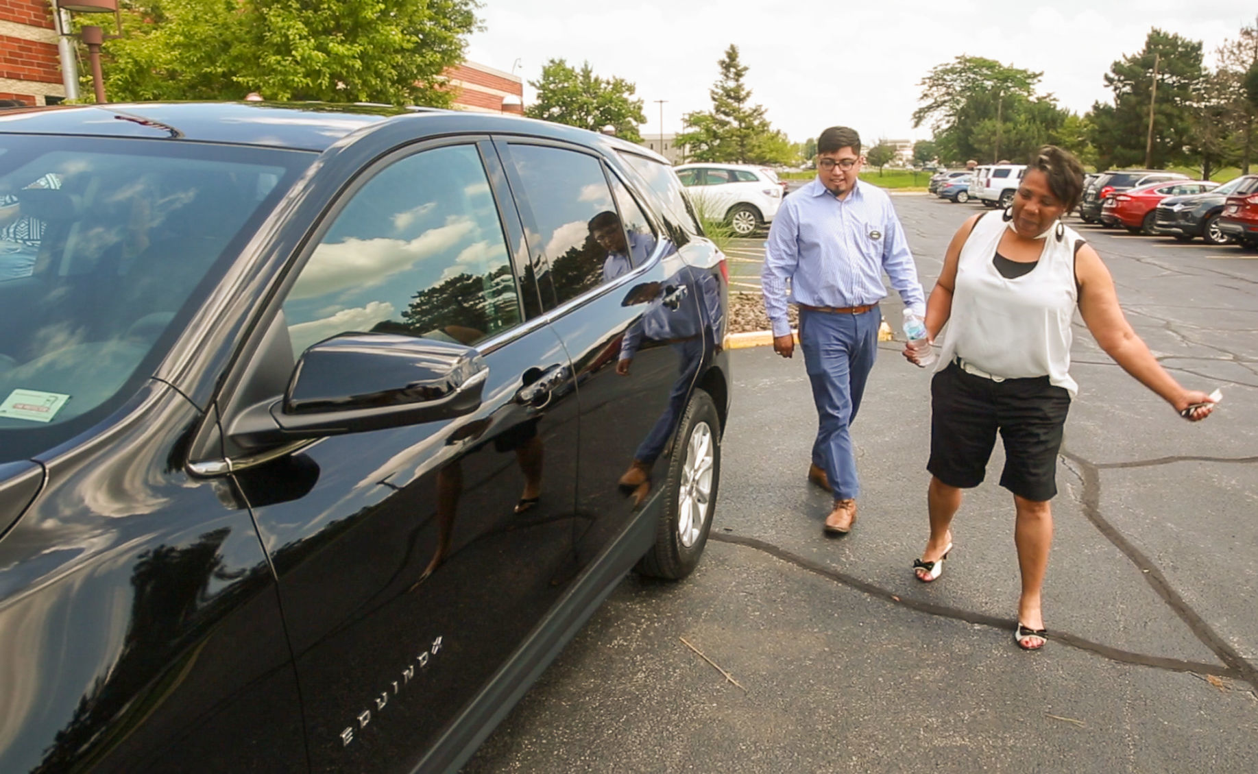 Presentation of new Chevy to Times/Chevy contest winner Lolita Whitehead